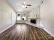 A spacious living room featuring a stone fireplace, windows, and light, airy atmosphere at 4808 Cedar Ct, Gastonia, NC 28056