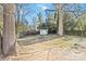 Backyard with trees and storage shed at 5717 Ruth Dr, Charlotte, NC 28215