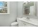 Modern bathroom boasts a stylish mirror, updated vanity, and tiled shower enclosure at 5717 Ruth Dr, Charlotte, NC 28215