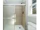 Bathroom featuring a glass-enclosed shower with tile surround and shower head at 5717 Ruth Dr, Charlotte, NC 28215