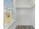 White closet with white trim and laminate floors at 5717 Ruth Dr, Charlotte, NC 28215