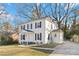 Attractive two-story home with a freshly painted white exterior and well-maintained landscaping at 5717 Ruth Dr, Charlotte, NC 28215