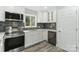 Recently remodeled kitchen with white cabinets, stainless steel appliances, and modern fixtures at 5717 Ruth Dr, Charlotte, NC 28215