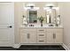 Modern bathroom featuring a double vanity with black hardware and ample lighting at 603 N Elm St, Cherryville, NC 28021