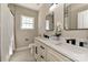 Bathroom boasts double sinks with white marble countertops and modern fixtures at 603 N Elm St, Cherryville, NC 28021