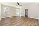Bright bedroom featuring hardwood floors, natural lighting, and a walk-in closet at 603 N Elm St, Cherryville, NC 28021