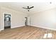 Bright bedroom with hardwood floors, natural light, and access to a bathroom at 603 N Elm St, Cherryville, NC 28021