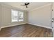 Bright bedroom features hardwood floors and large windows at 603 N Elm St, Cherryville, NC 28021