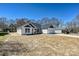 Charming exterior features a well-manicured lawn and attached garage at 603 N Elm St, Cherryville, NC 28021
