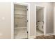 Hallway with access to laundry room and modern half bathroom at 603 N Elm St, Cherryville, NC 28021