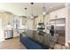 An updated kitchen with stainless steel appliances, a central island, and pendant lighting fixtures at 603 N Elm St, Cherryville, NC 28021