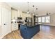 A gourmet kitchen with stainless steel appliances, a breakfast bar, and modern lighting fixtures at 603 N Elm St, Cherryville, NC 28021