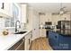 An updated kitchen features a white tiled backsplash, stainless steel appliances, and granite countertops at 603 N Elm St, Cherryville, NC 28021