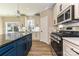 A modern kitchen featuring a kitchen island with seating, and stainless steel appliances at 603 N Elm St, Cherryville, NC 28021