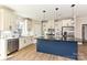 A kitchen with a breakfast bar, stainless steel appliances, and sleek pendant lighting at 603 N Elm St, Cherryville, NC 28021
