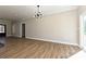 Open living area with sleek flooring, modern lighting, and natural light at 603 N Elm St, Cherryville, NC 28021