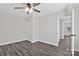 A bedroom featuring modern flooring, neutral walls, ceiling fan and closet at 606 N Elm St, Marshville, NC 28103