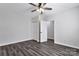 A bedroom featuring modern flooring, neutral walls, ceiling fan and closet at 606 N Elm St, Marshville, NC 28103