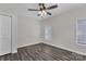 A bedroom featuring modern flooring, neutral walls, ceiling fan, closet and natural light at 606 N Elm St, Marshville, NC 28103