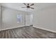 A bedroom featuring modern flooring, neutral walls, ceiling fan and natural light at 606 N Elm St, Marshville, NC 28103