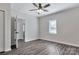 A bedroom featuring modern flooring, neutral walls, ceiling fan, closet and natural light at 606 N Elm St, Marshville, NC 28103