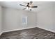 A bedroom featuring modern flooring, neutral walls, ceiling fan and natural light at 606 N Elm St, Marshville, NC 28103