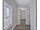 A hallway featuring modern flooring and natural light at 606 N Elm St, Marshville, NC 28103
