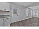 Bright dining area with a view into the backyard and white cabinets with black hardware at 606 N Elm St, Marshville, NC 28103