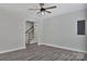 Bright living room showcasing wood-look floors and an open view of the staircase at 606 N Elm St, Marshville, NC 28103