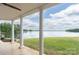 Covered back porch with lake views and beautiful columns at 627 Birdie Ln # 21/22, Norwood, NC 28128