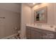 Bathroom featuring a neutral colored vanity, a mirror, and tile flooring at 627 Birdie Ln # 21/22, Norwood, NC 28128
