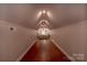 Long bonus room or attic space showcasing recessed lighting and a comfortable seating area at 627 Birdie Ln # 21/22, Norwood, NC 28128