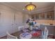 Charming dining area featuring custom cabinets, table with seating, and a view from window at 627 Birdie Ln # 21/22, Norwood, NC 28128