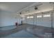 Spacious three car garage with ample lighting and a clean, well-maintained floor at 627 Birdie Ln # 21/22, Norwood, NC 28128