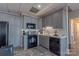 Well-equipped kitchen with sleek black appliances, gray cabinetry, and tiled backsplash at 627 Birdie Ln # 21/22, Norwood, NC 28128