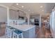 Modern kitchen with stainless steel appliances, quartz countertops, and ample cabinet space at 627 Birdie Ln # 21/22, Norwood, NC 28128