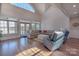 Spacious living room featuring large windows with lake views and comfortable seating at 627 Birdie Ln # 21/22, Norwood, NC 28128