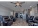 Living room and kitchen with recliners, stainless appliances, and tile flooring at 627 Birdie Ln # 21/22, Norwood, NC 28128
