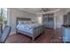 Spacious bedroom boasts a ceiling fan, closet, and large window for ample natural light at 627 Birdie Ln # 21/22, Norwood, NC 28128