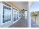 Covered porch with views of the lake at 627 Birdie Ln # 21/22, Norwood, NC 28128