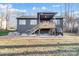 Backyard featuring a deck, stairs, patio area with a grill, and a covered ATV at 7595 Lakehaven Dr, Denver, NC 28037