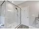 Beautiful bathroom featuring a spacious walk-in shower with white marble surround and bench seating at 7595 Lakehaven Dr, Denver, NC 28037