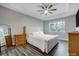 Serene main bedroom features a tray ceiling, large window, and neutral decor at 7595 Lakehaven Dr, Denver, NC 28037