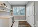 Stylish home office with natural light and custom shelving at 7595 Lakehaven Dr, Denver, NC 28037