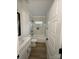 Bright bathroom features marble tiled shower over tub, a modern vanity, and wood grain floors at 803 Fargo Dr, Concord, NC 28027