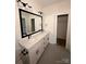 Bathroom with double vanity, modern fixtures, and a walk-in closet at 803 Fargo Dr, Concord, NC 28027