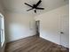 Bedroom with a ceiling fan, hardwood floors, and a view to the kitchen at 803 Fargo Dr, Concord, NC 28027