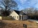 Attractive one-story home with white siding and a well-maintained front yard and wood fence at 803 Fargo Dr, Concord, NC 28027