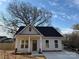 Charming single-story home boasts a welcoming front porch and neutral siding at 803 Fargo Dr, Concord, NC 28027