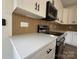 Close-up of kitchen with white countertops, stainless steel appliances, and modern backsplash at 803 Fargo Dr, Concord, NC 28027